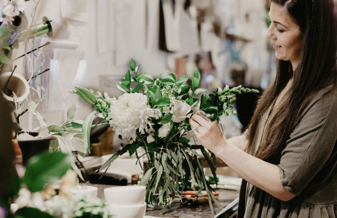 Lacey Koeslag works on a bouquet inside Elora St. Flowers