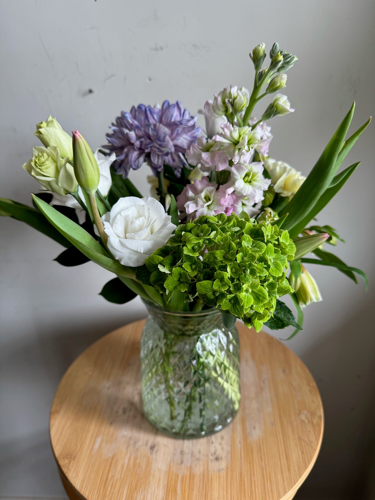 Mixed Spring Arrangement in Diamond-Cut Glass Vase