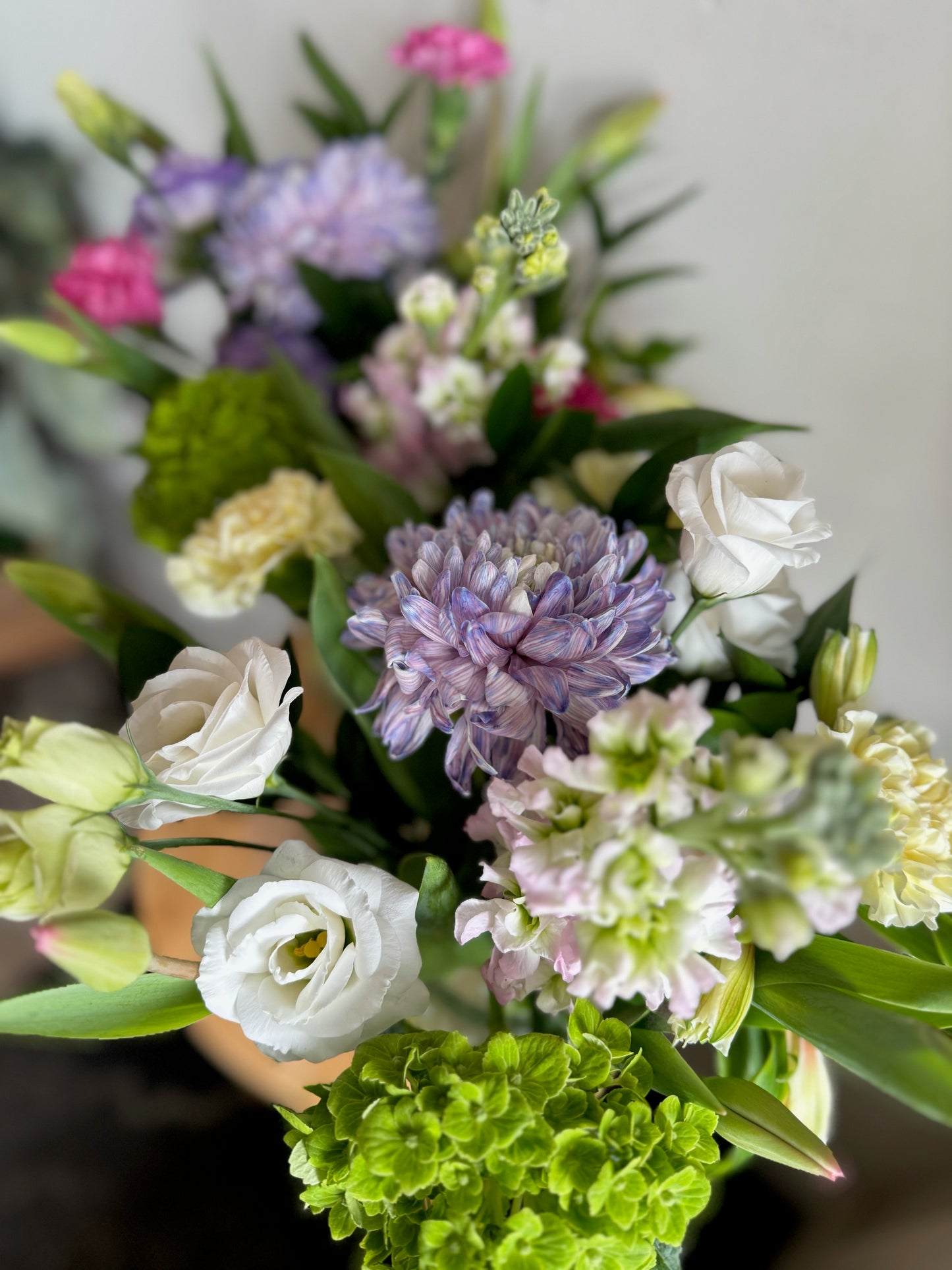 Mixed Spring Arrangement in Diamond-Cut Glass Vase