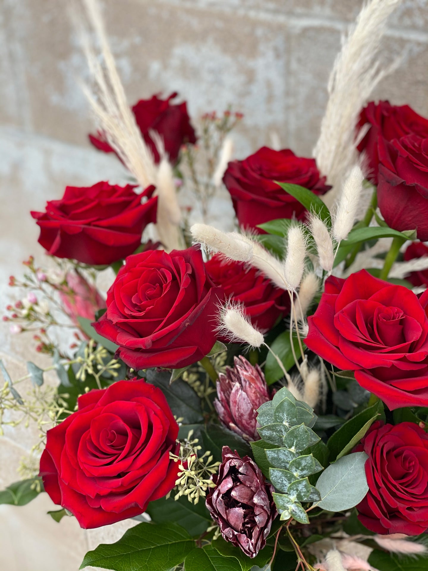 DELUXE Dozen Luxury Red Roses in a Vase