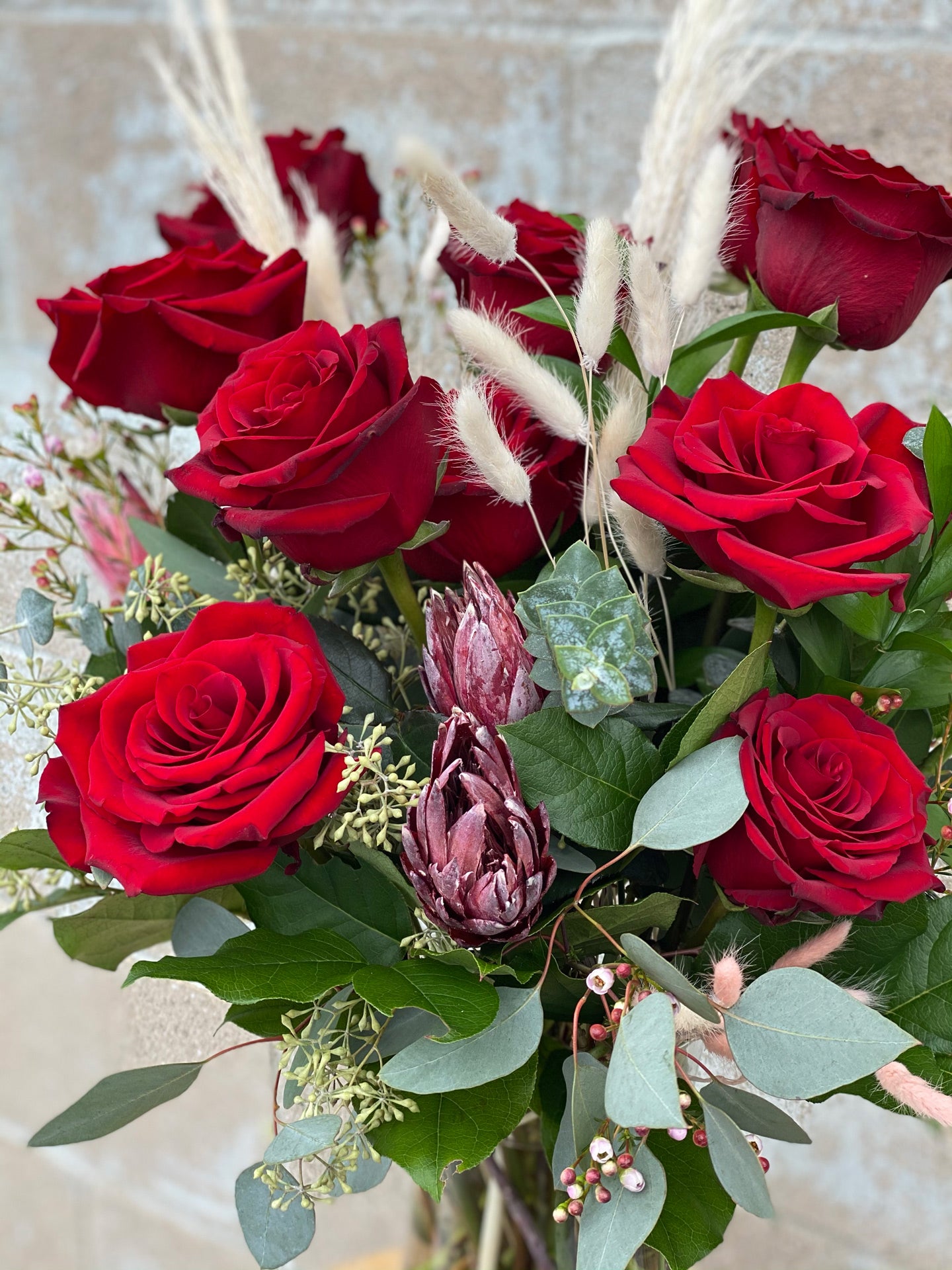 DELUXE Dozen Luxury Red Roses in a Vase